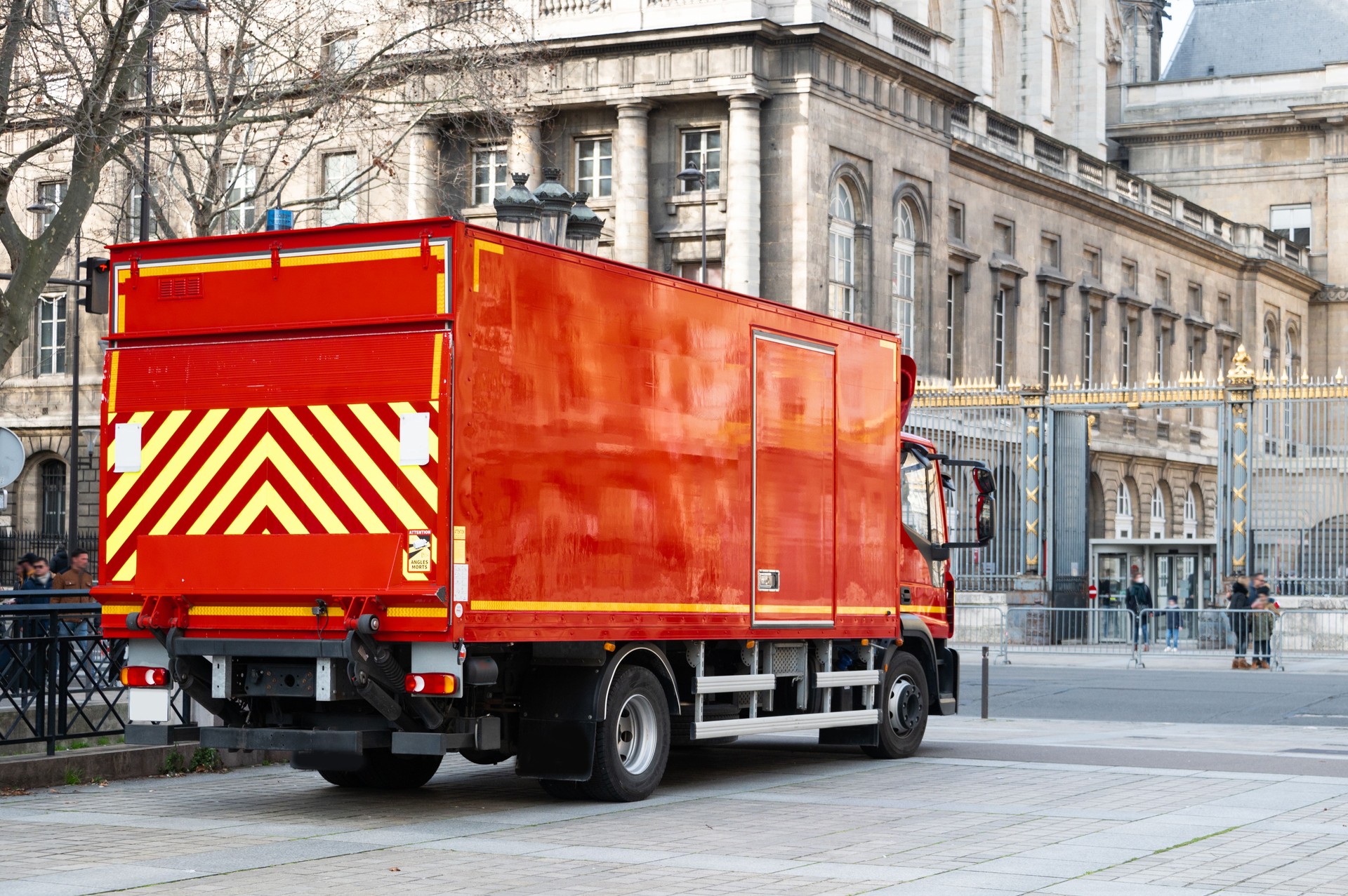 Red semi truck in a city